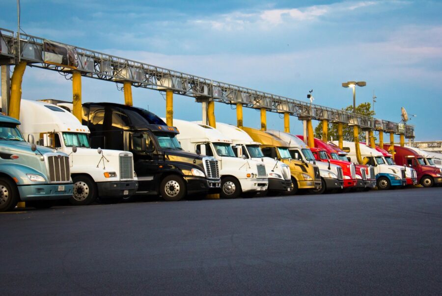 Various commercial motor vehicles parked in a row